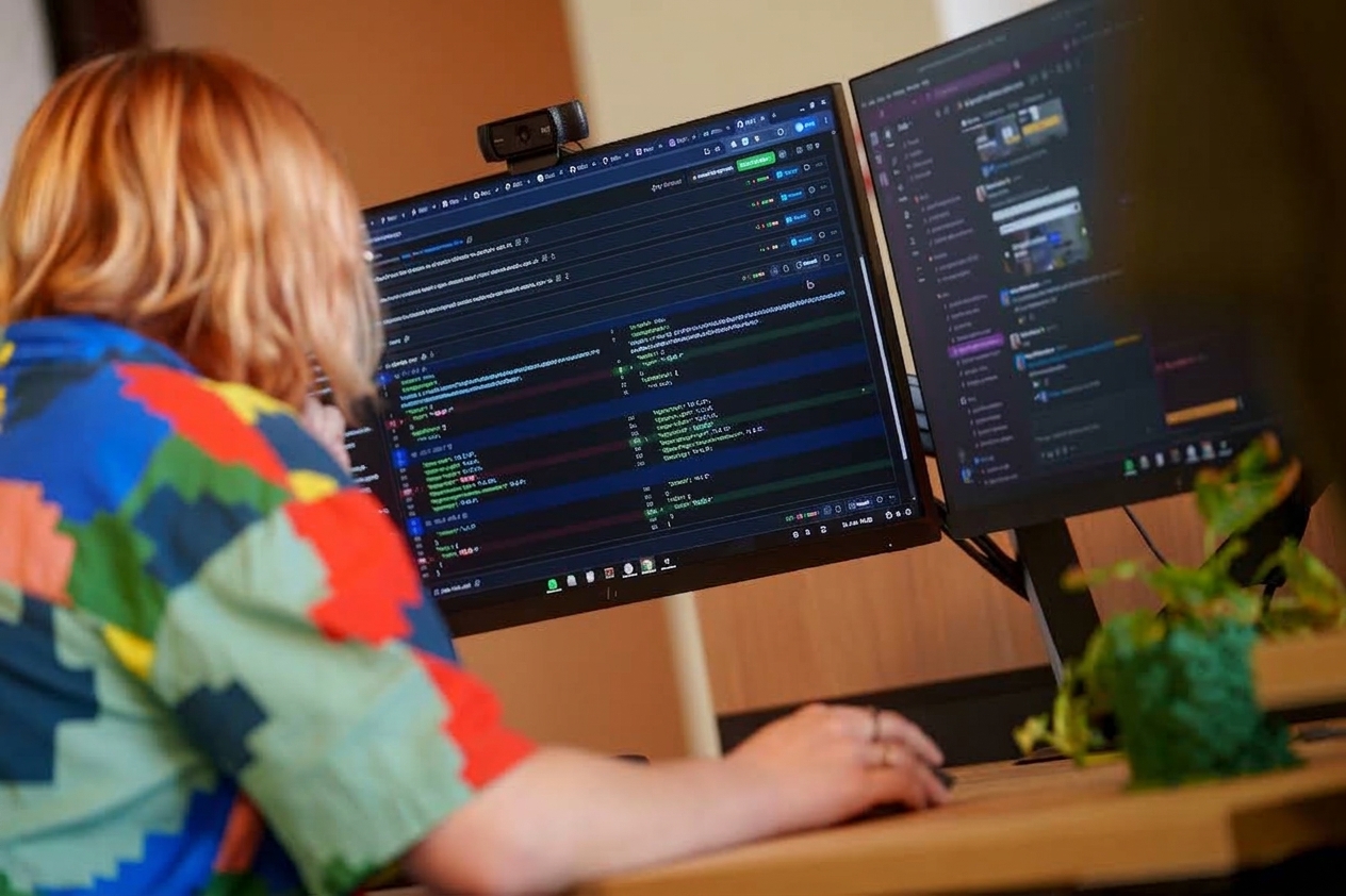 Developers discussing improvements to existing software